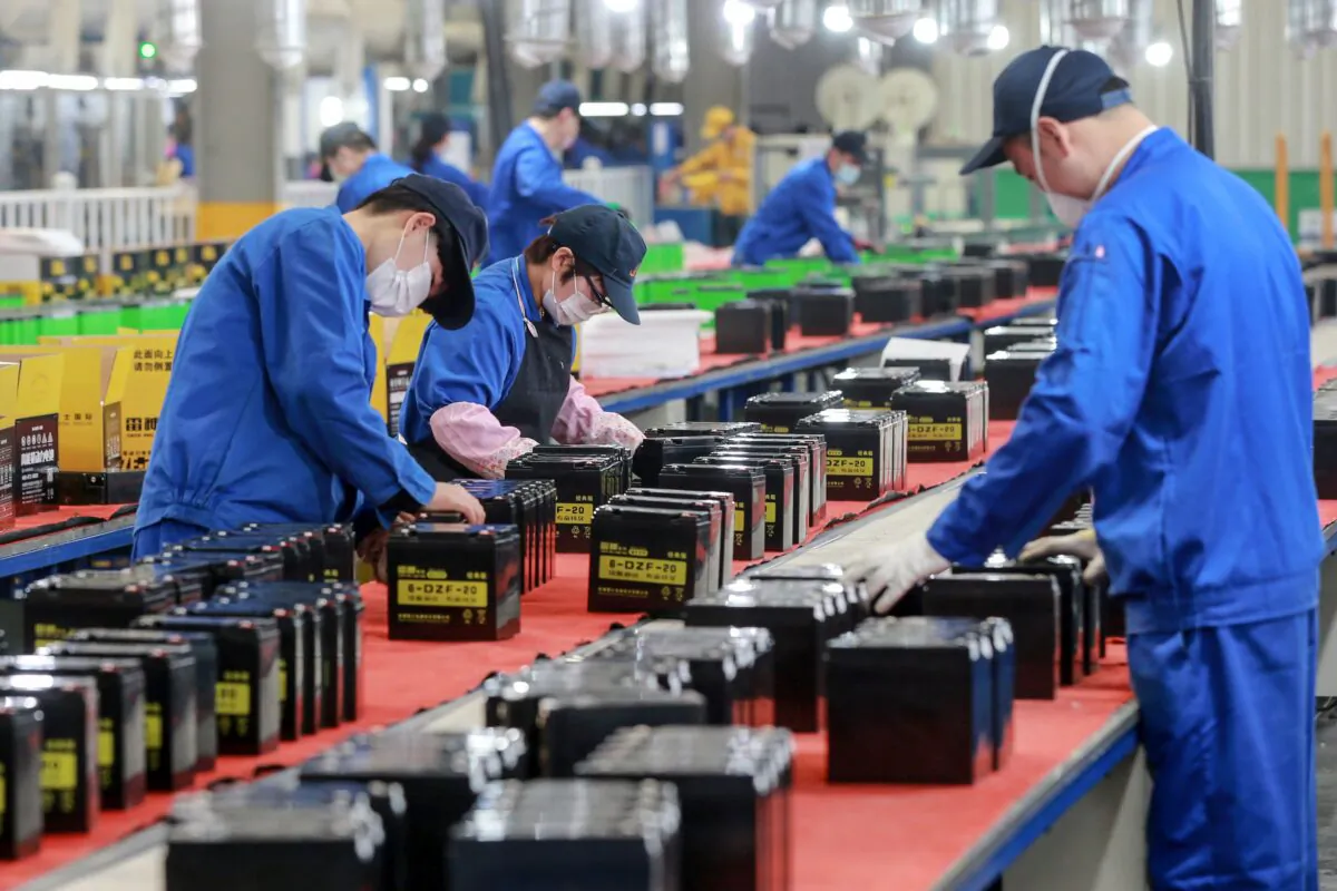 Employees are working on a battery production line at a factory in Huaibei in China's eastern Anhui Province on March 30, 2020. (STR/AFP via Getty Images)