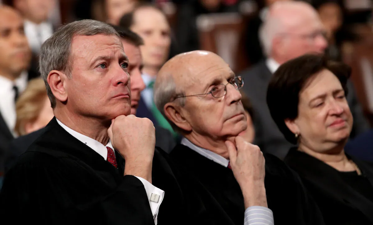 U.S. Supreme Court Chief Justice John G. Roberts (L-R), Associate Justice Stephen G. Breyer, and Associate Justice Elena Kagan listen to President Trump's State of the Union address in the chamber of the U.S. House of Representatives in Washington, on Jan. 30, 2018. (Win McNamee/Getty Images)