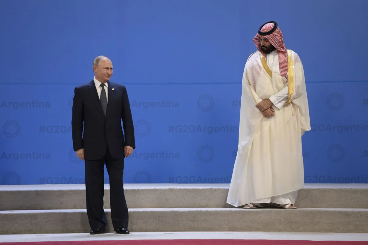 Russia's President Vladimir Putin and Saudi Arabia's Crown Prince Mohammed bin Salman line up for a group photo, during the G-20 Leaders' Summit in Buenos Aires, on Nov. 30, 2018. (JUAN MABROMATA/AFP via Getty Images)