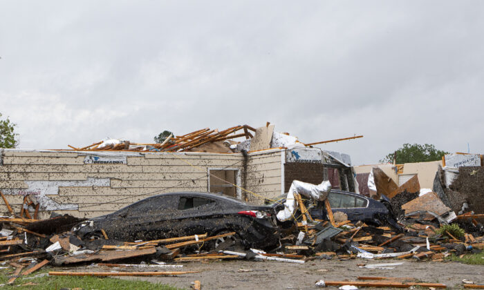 A home had its roof torn off after a tornado ripped through Monroe, La., just before noon on  April 12, 2020. (Nicolas Galindo/The News-Star via AP)