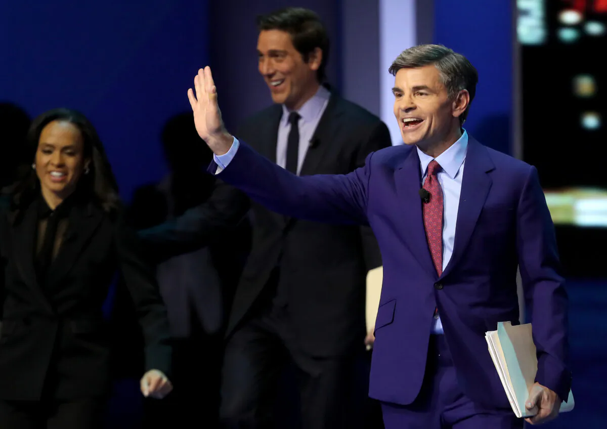 George Stephanopoulos (R) arrives at the Democratic presidential primary debate in the Sullivan Arena at St. Anselm College in Manchester, N.H., on Feb. 7, 2020. (Win McNamee/Getty Images)