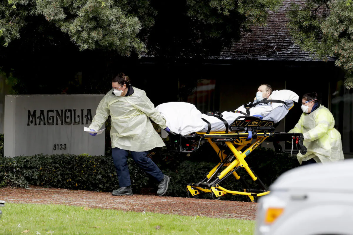 A patient is evacuated from the Magnolia Rehabilitation and Nursing Center in Riverside, Calif., on April 8, 2020. (Chris Carlson/AP)