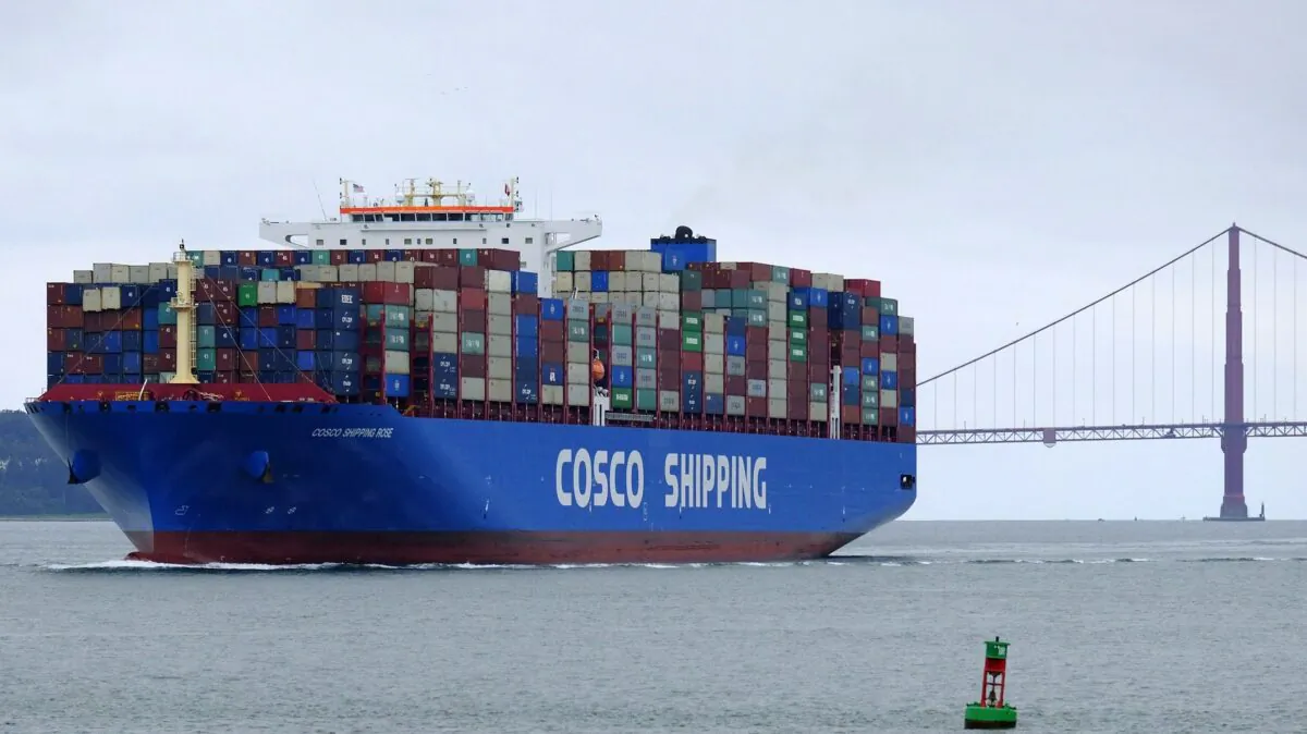 A China Ocean Shipping Company container ship passes the Golden Gate Bridge in San Francisco on May 14, 2019, bound for the Port of Oakland. (AP Photo/Eric Risberg)
