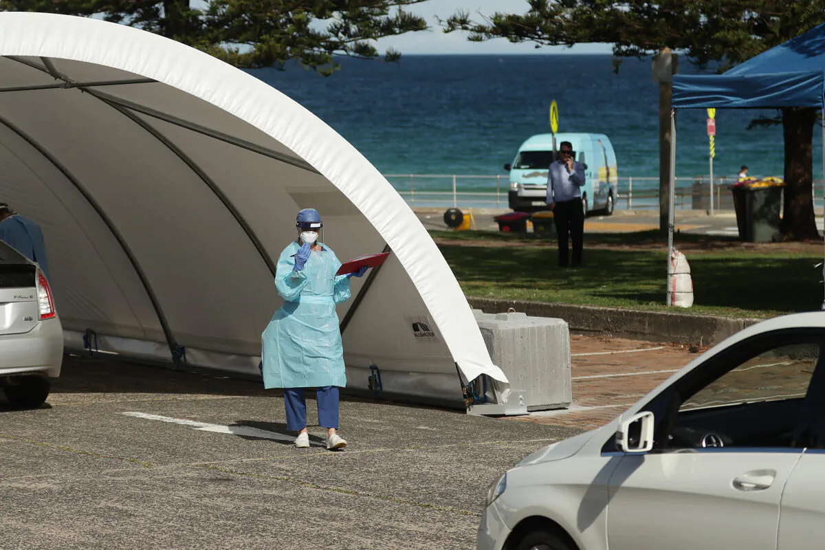 Medical professionals administer COVID-19 tests at the Bondi Beach drive-through COVID-19 testing center on April 6, 2020 in Sydney, Australia. (Mark Metcalfe/Getty Images)