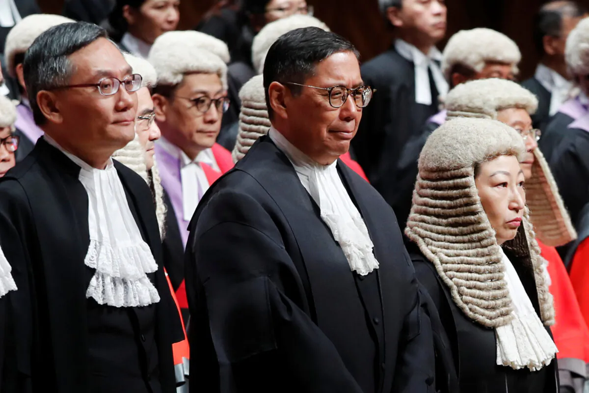 (L-R) Judges of the Court of Final Appeal Andrew Cheung Kui-nung, Robert Ribeiro and Secretary of Justice Teresa Cheng attend a ceremony to mark the beginning of the legal year in Hong Kong, China, on Jan. 14, 2019. (Tyrone Siu/Reuters)