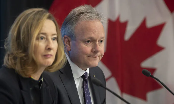 Bank of Canada governor Stephen Poloz and senior deputy governor Carolyn Wilkins listen to a question during a news conference in Ottawa on Jan. 22, 2020. (The Canadian Press/Adrian Wyld)