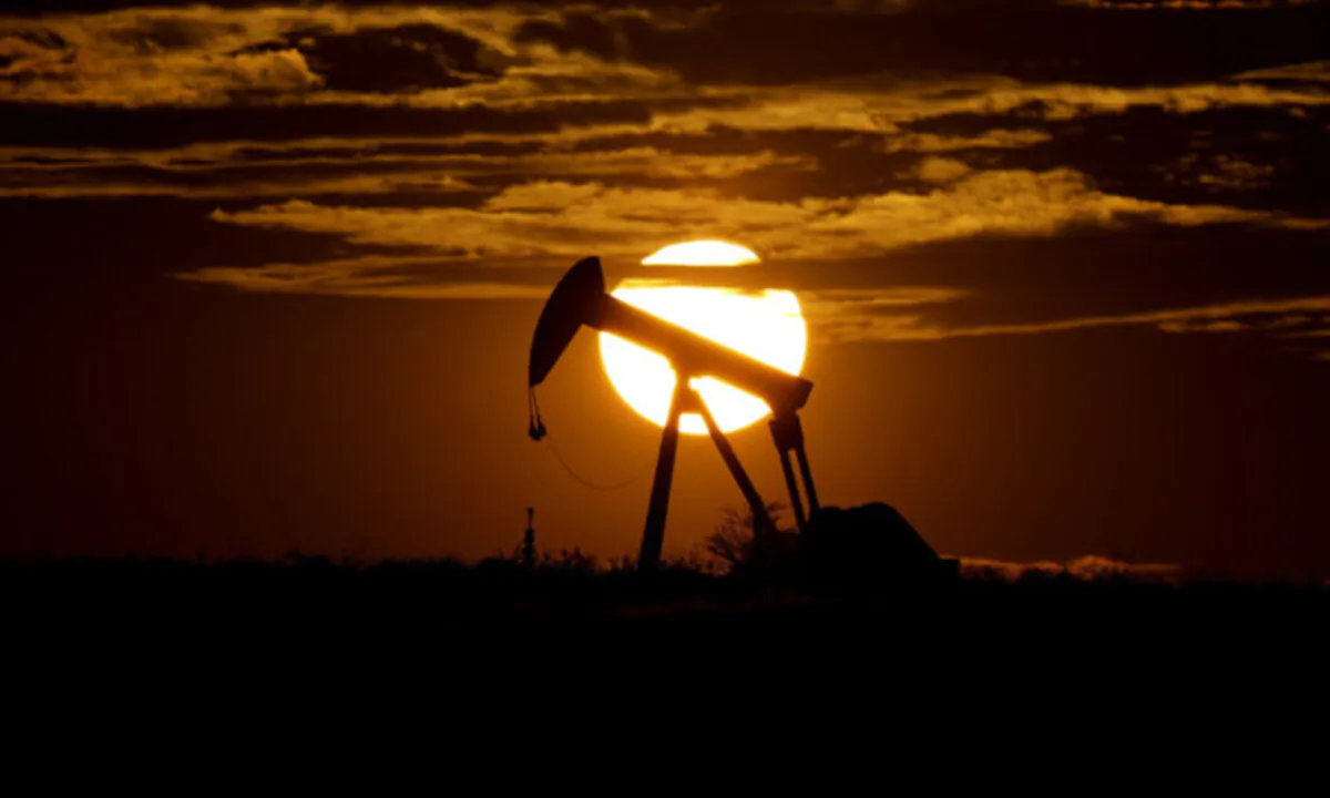 The sun sets behind an idle pump jack near Karnes City, Texas, on April 8, 2020. (Eric Gay/AP Photo)