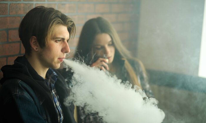 Young people vaping. (Shutterstock)