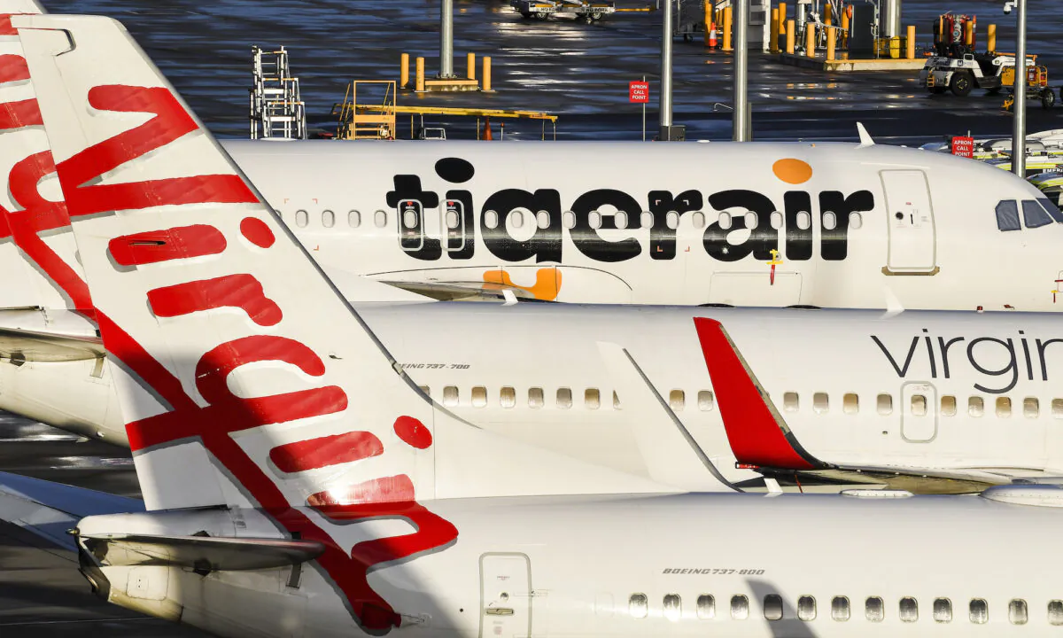 Tiger Air and Virgin sit idle on the tarmac at Melbourne's Tullamarine Airport on April 12, 2020. (William West/AFP via Getty Images)