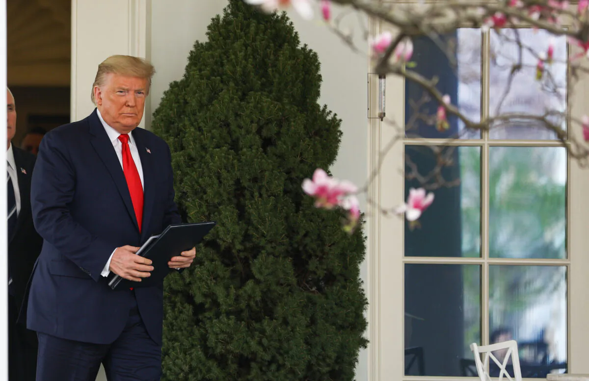 President Donald Trump exits the Oval Office before announcing a national emergency with regard to the coronavirus in the White House Rose Garden in Washington on March 13, 2020. (Charlotte Cuthbertson/The Epoch Times)
