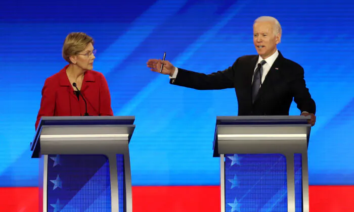 Democratic presidential candidates Sen. Elizabeth Warren (D-MA) and former Vice President Joe Biden participate in a primary debate in New Hampshire on Feb. 7, 2020. (Joe Raedle/Getty Images)