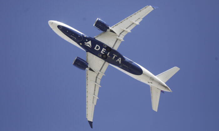 A Delta flight takes off from Salt Lake City International airport in Salt Lake City on April 7, 2020. (Rick Bowmer/AP)