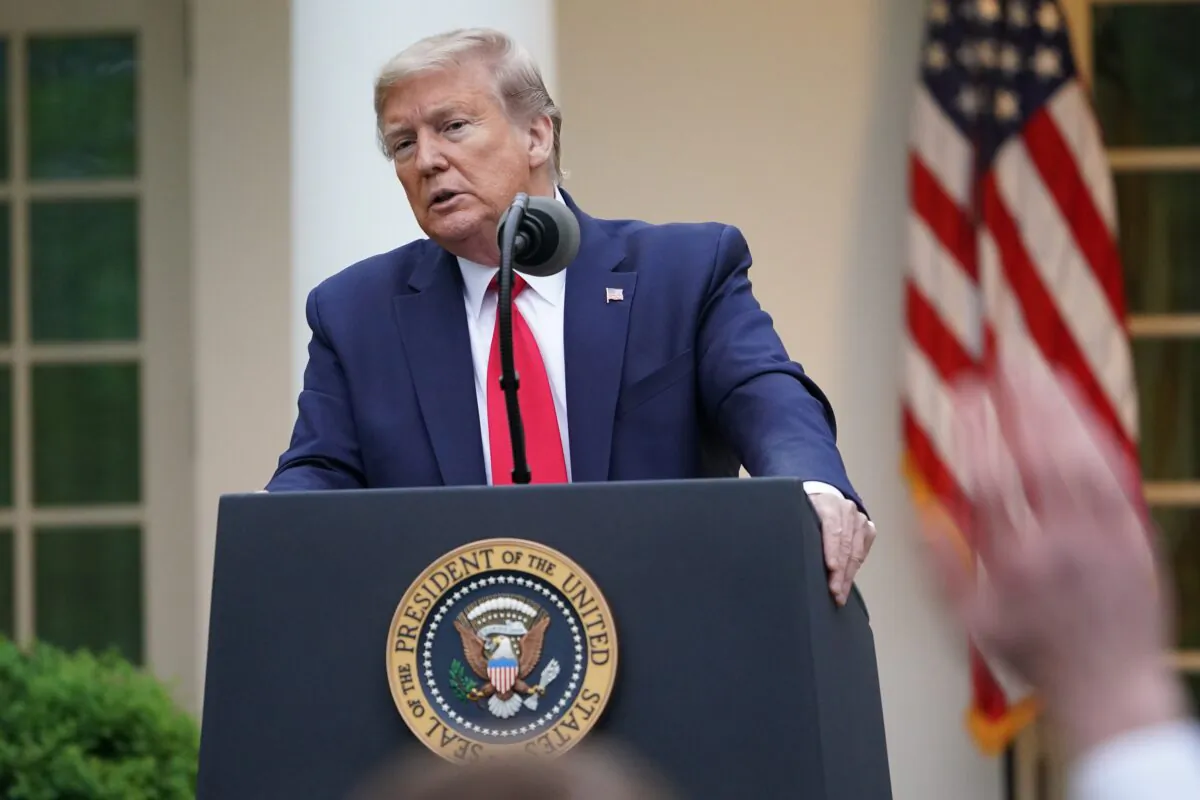 President Donald Trump speaks during the daily briefing on the CCP virus in the Rose Garden of the White House in Washington on April 14, 2020. (Mandel Ngan/AFP via Getty Images)