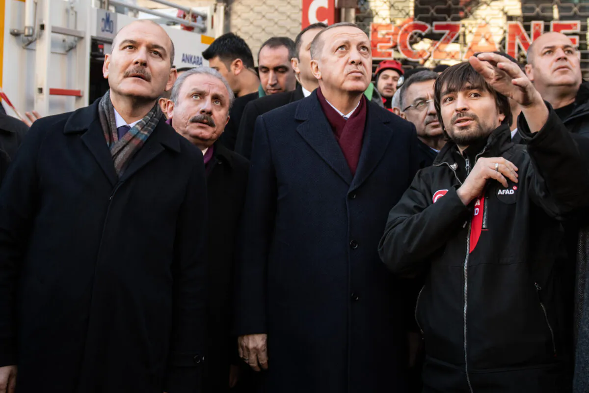 Turkish President Recep Tayyip Erdogan, Interior minister Suleyman Soylu (L) and head of Turkish Parliament Mustafa Sentop (2nd L) visits the earthquake site on Jan. 25, 2020 in Elazig, Turkey. (Burak Kara/Getty Images)