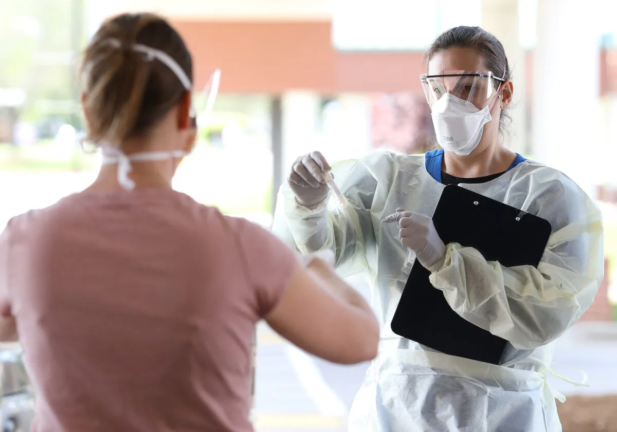 A nurse administers COVID-19 testing at a drive-up facility at MedStar St. Mary's Hospital in Leonardtown, Maryland on April 14, 2020. (Win McNamee/Getty Images)