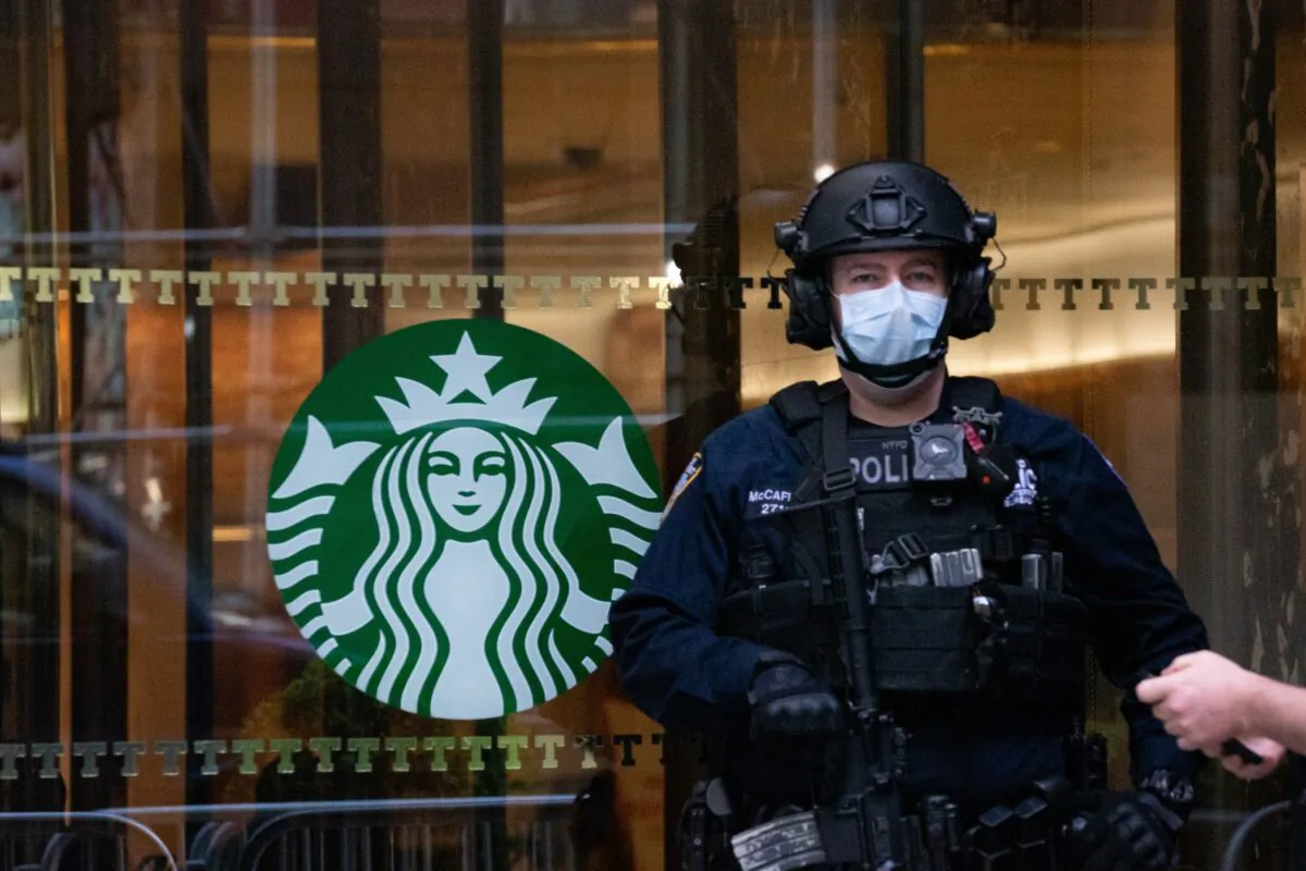 A police officer wearing a mask stands watch at Trump Tower in New York City on April 14, 2020. (David Dee Delgado/Getty Images)