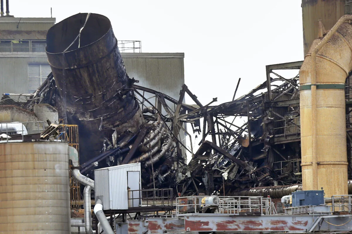 Wreckage smolders at the Androscoggin Mill after an explosion at the paper mill in Jay, Maine, on April 15, 2020. (Robert F. Bukaty/AP Photo)