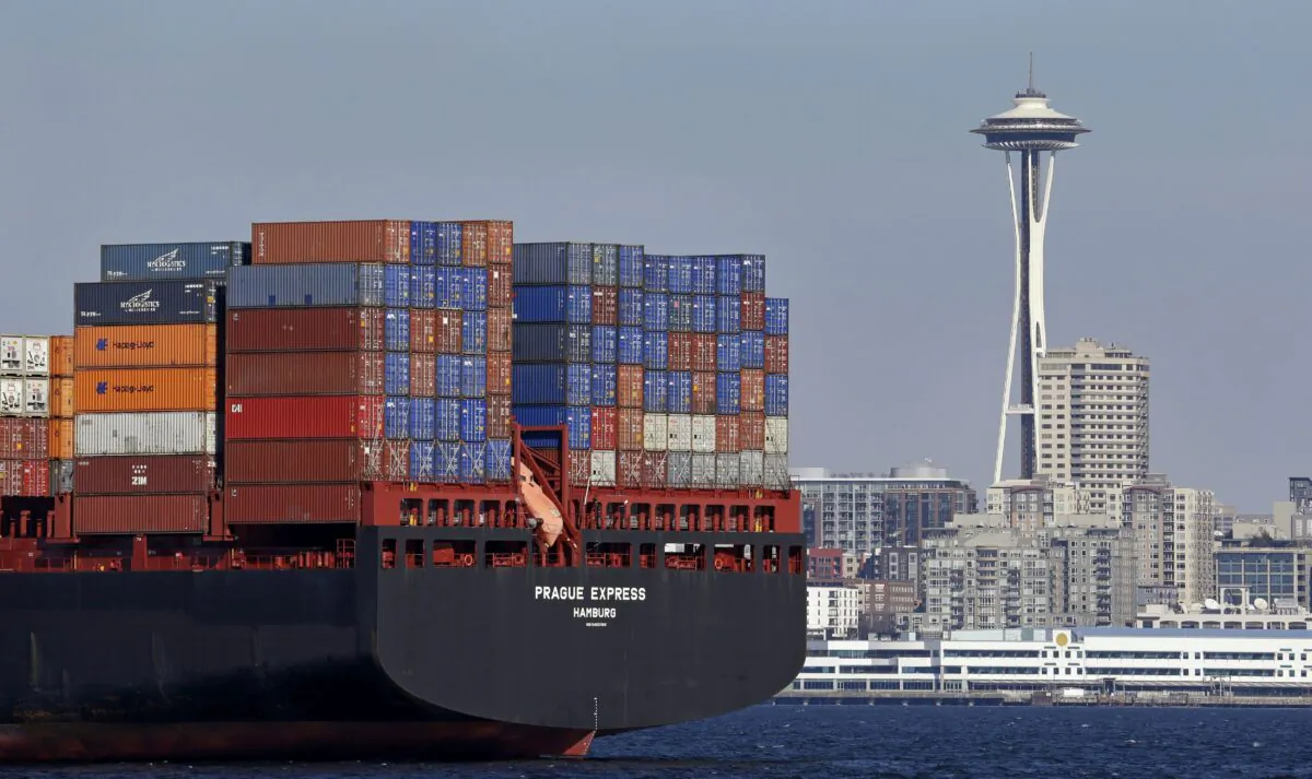 The Prague Express container ship is anchored in Elliott Bay near downtown Seattle in a file photo. (AP Photo/Elaine Thompson, File)
