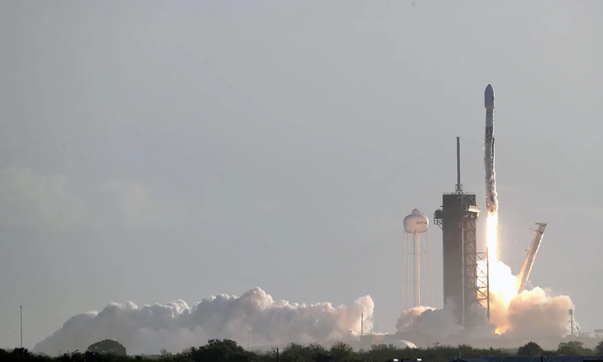 A Falcon 9 SpaceX rocket with a payload of approximately 60 satellites for SpaceX's Starlink broadband network lifts off from pad 39A at the Kennedy Space Center in Cape Canaveral, Fla., on March 18, 2020. (John Raoux/AP Photo)