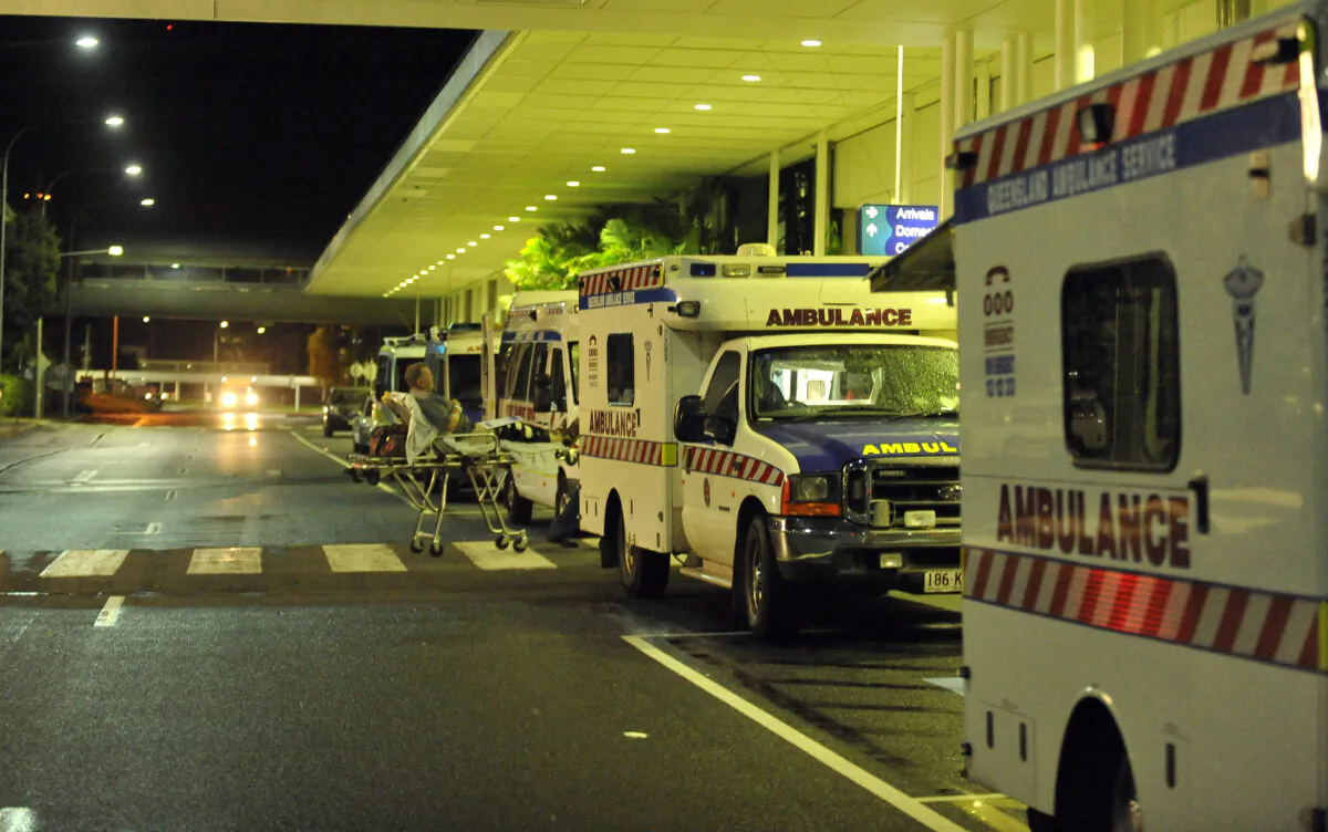 Ambulances are lined up outside the International Terminal at Cairns Airport in Queensland, Australia, on Feb. 2, 2011. (Paul Crock/AFP via Getty Images)