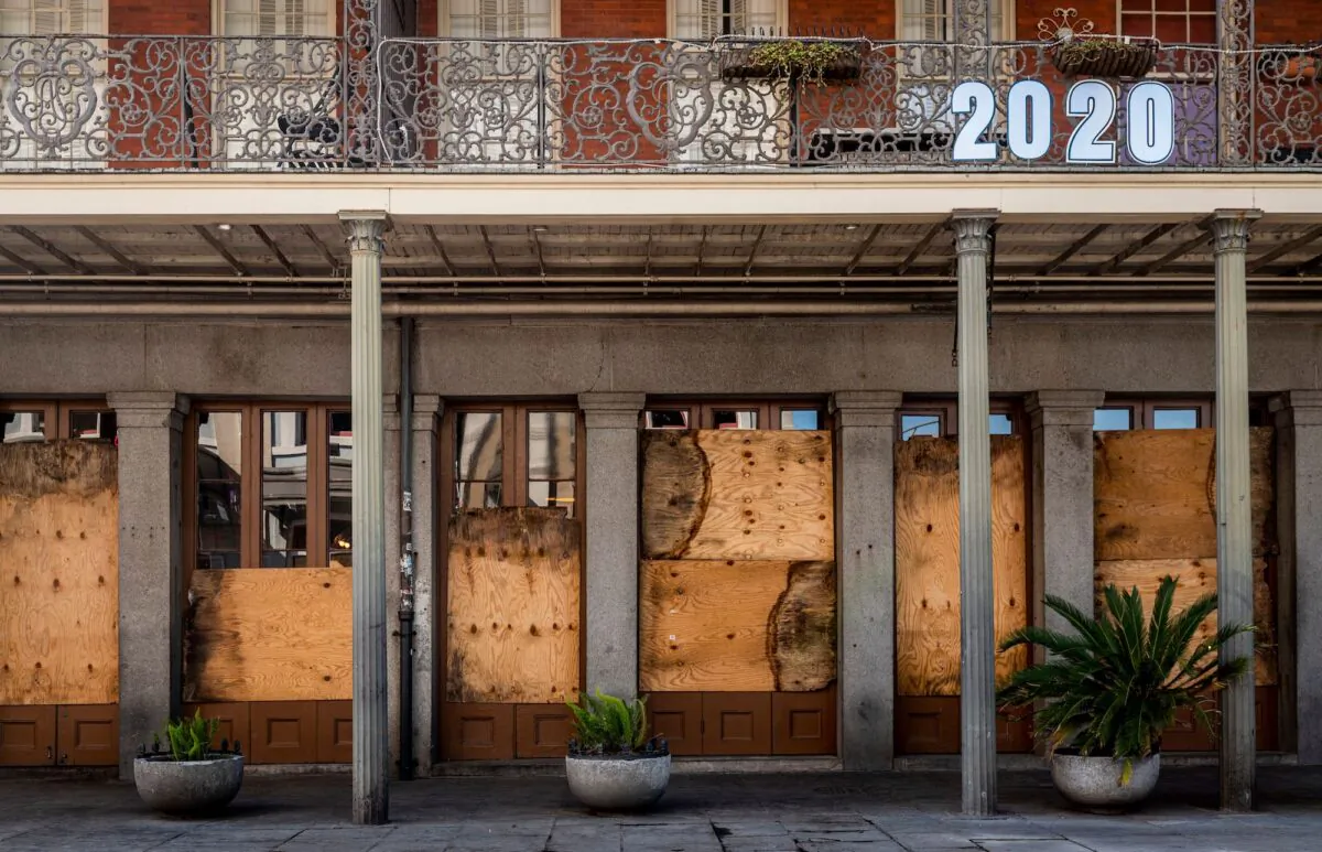 A shuttered business is pictured on Decatur Street in New Orleans, La., on March 26, 2020. (Emily Kask/AFP/Getty Images)