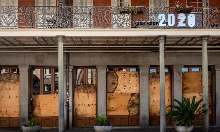 A shuttered business is pictured on Decatur Street in New Orleans, La., on March 26, 2020. (Emily Kask/AFP/Getty Images)