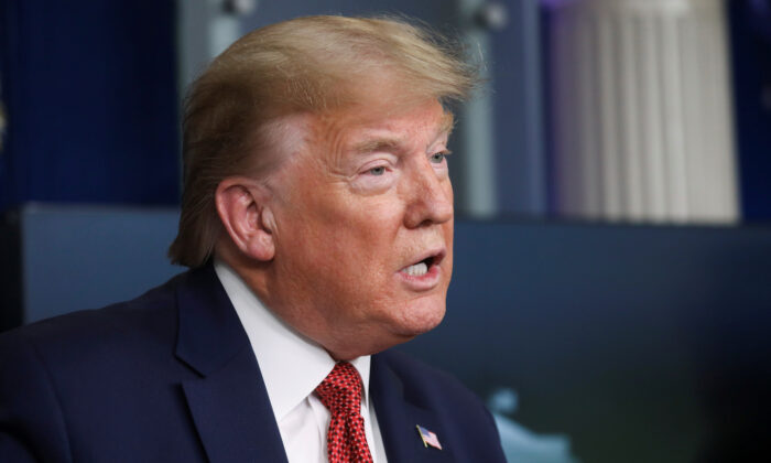 President Donald Trump announces guidelines for "Opening Up America Again" as he addresses the daily coronavirus task force briefing at the White House in Washington on April 16, 2020. (Leah Millis/REUTERS)