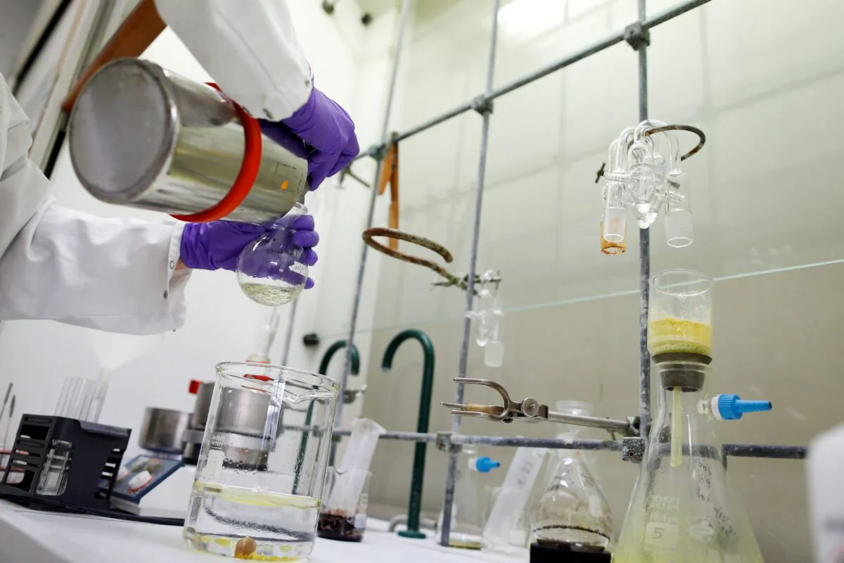 A researcher works at a Johnson & Johnson research facility, in Val-de-Reuil, northwestern France, on Nov. 30, 2017. (Charly Triballeau/AFP via Getty Images)