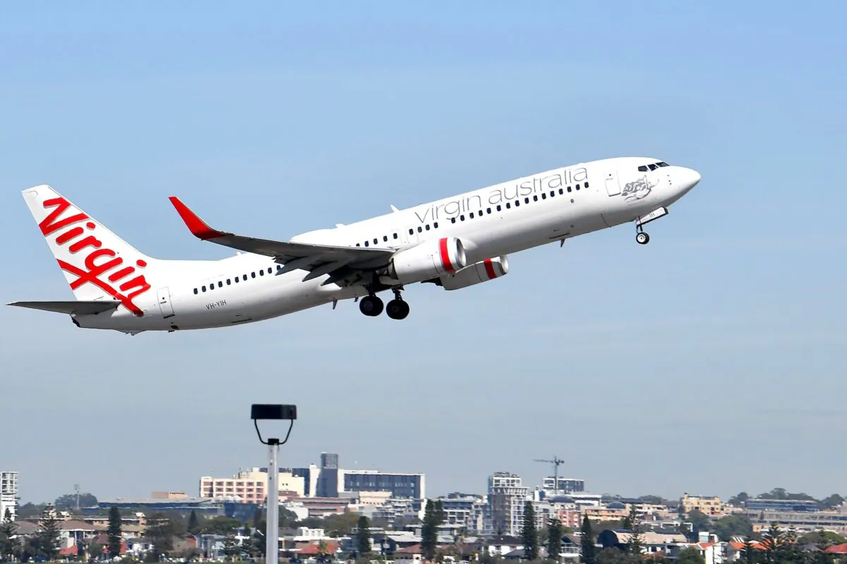 A Virgin plane takes off from Sydney Airport in Sydney on March 19, 2020. (Saeed Khan/AFP via Getty Images)