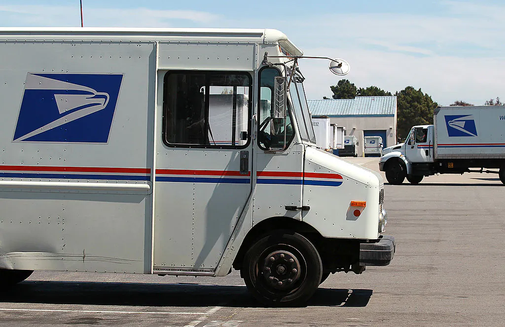 U.S. Postal Service trucks near the loading dock at the U.S. Post Office sort center in San Francisco on Aug. 12, 2011. (Photo by Justin Sullivan/Getty Images)