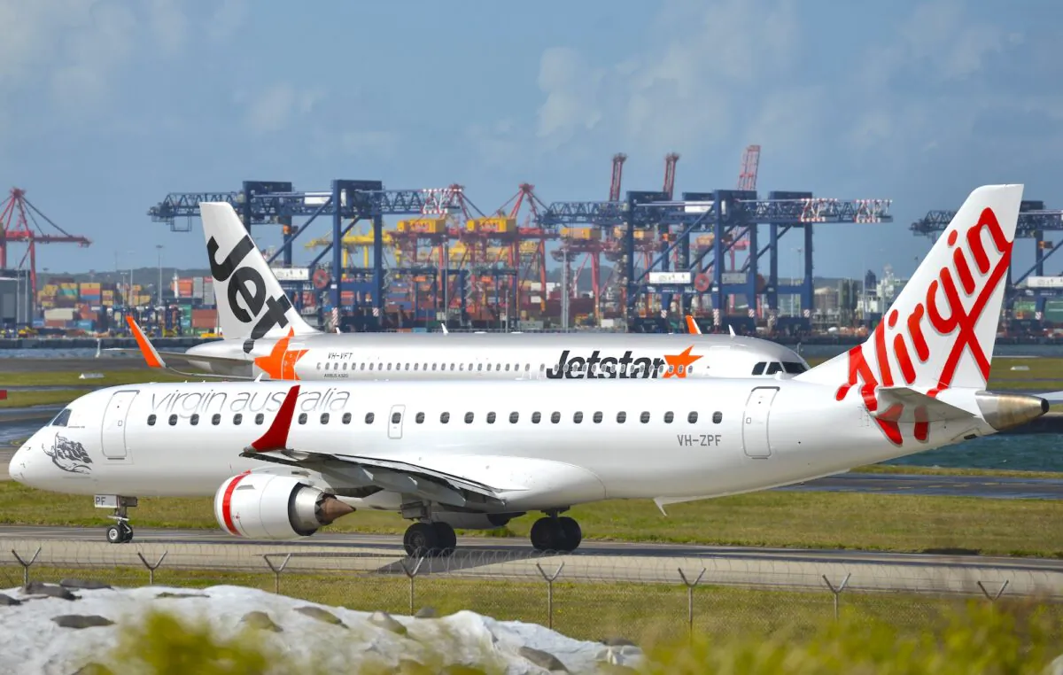 Virgin and Jetstar planes get ready to take off from Sydney Airport on Aug. 28, 2014. (Peter Parks/AFP via Getty Images)