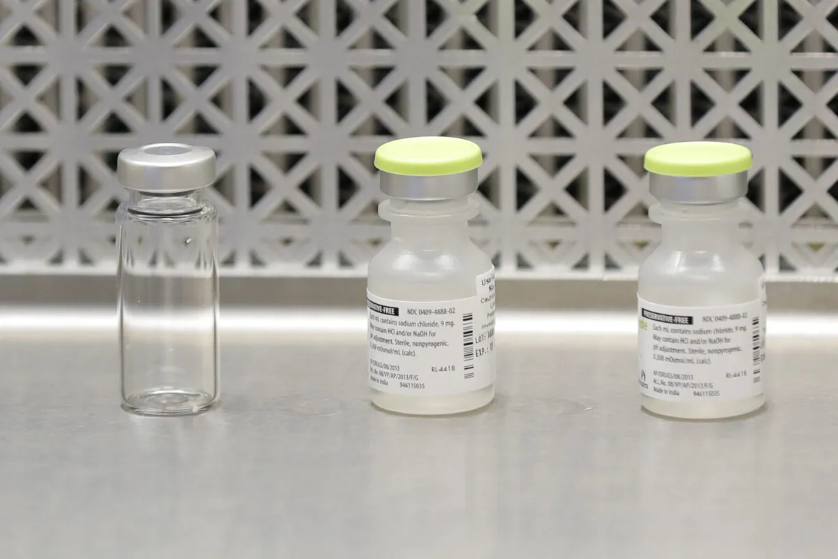 Vials used by pharmacists to prepare syringes used on the first day of a first-stage safety study clinical trial of the potential vaccine for COVID-19, the disease caused by the CCP virus, at the Kaiser Permanente Washington Health Research Institute in Seattle on March 16, 2020. (Ted S. Warren/AP Photo)