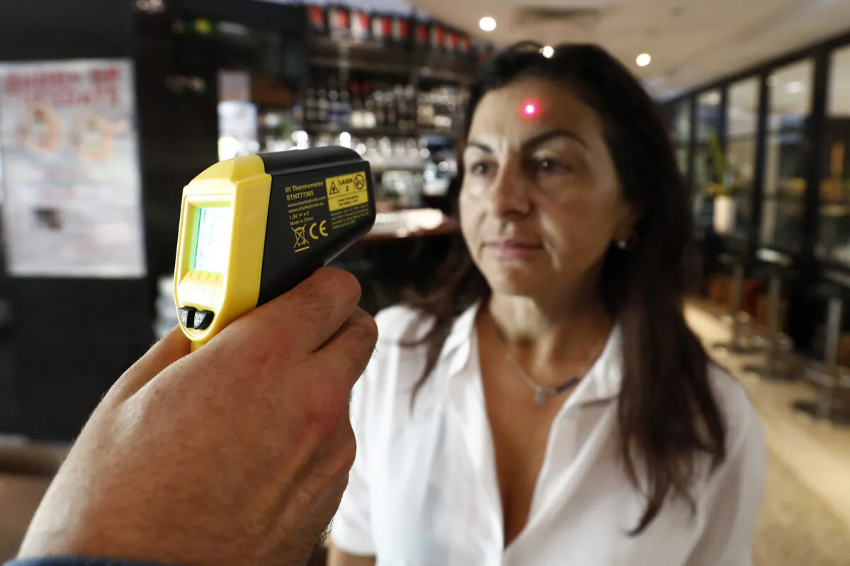 MELBOURNE, AUSTRALIA - MARCH 17: Paul Skidone, manager of Southbank restaurant La Camera is one of the temperature testing customers . (Darrian Traynor/Getty Images)