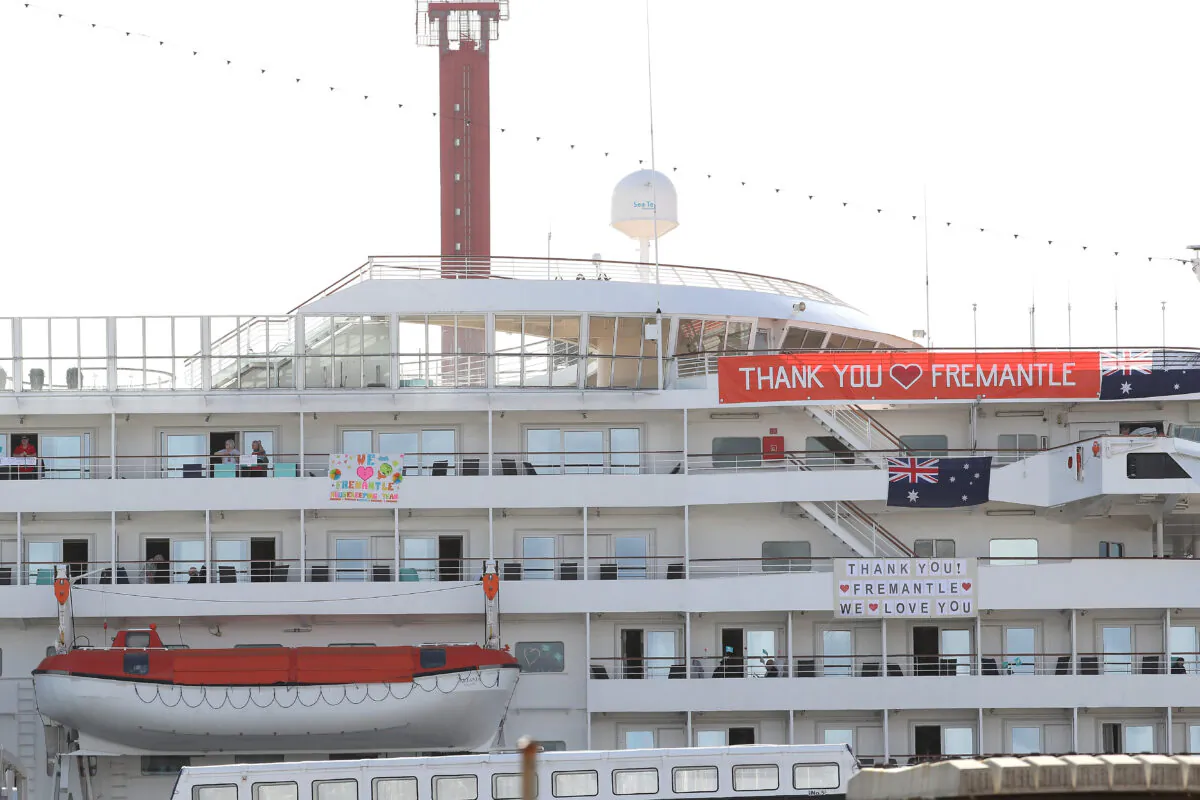 FREMANTLE, AUSTRALIA - MARCH 28: The MV Artania is seen with "Thank You Fremantle" banners at the Fremantle Passenger Terminal on March 28, 2020. (Photo by Paul Kane/Getty Images)