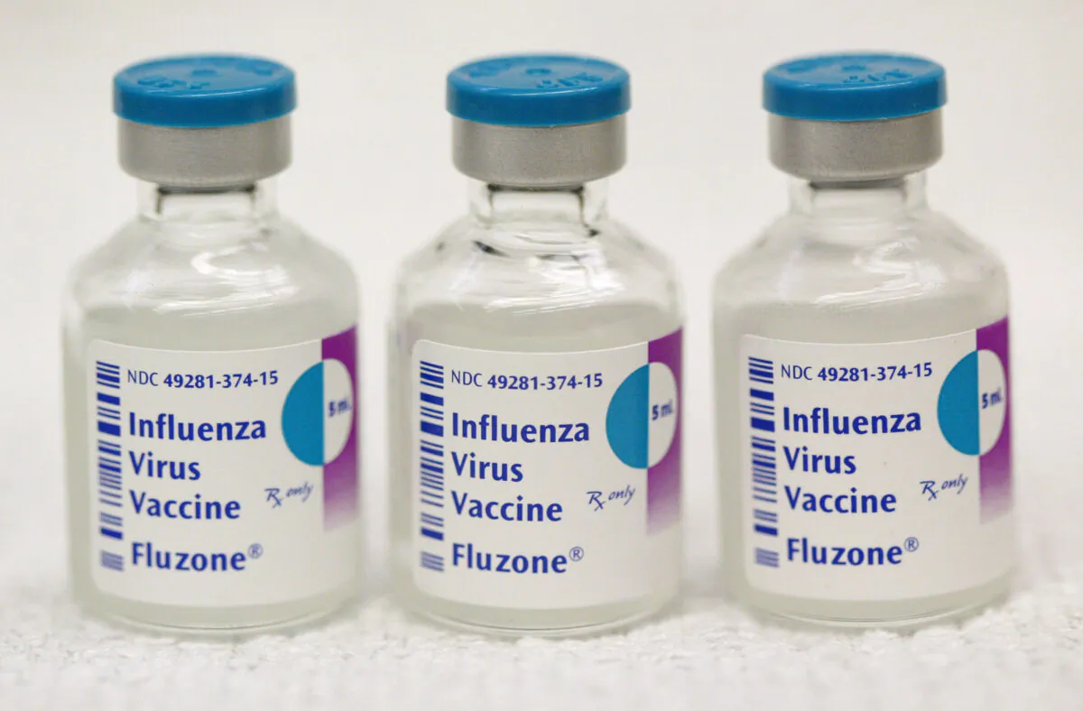 Three 10-dose influenza virus vaccine vials are seen at Ballin Pharmacy in Chicago, Illinois on October 8, 2004. (Tim Boyle/Getty Images)