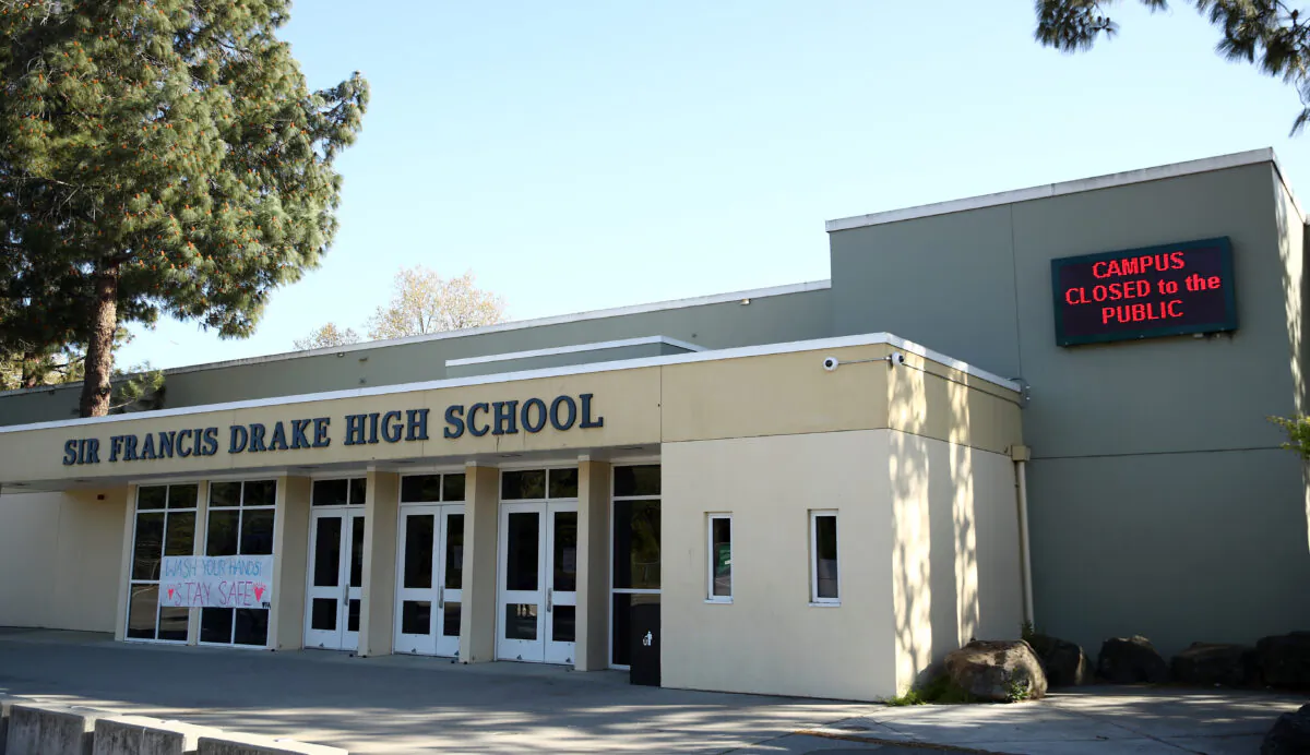 Signs outside Sir Francis Drake High School show that the school is closed because of COVID-19 in San Anselmo, Calif., on March 31, 2020. (Ezra Shaw/Getty Images)