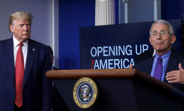 President Donald Trump listens to Dr Anthony Fauci