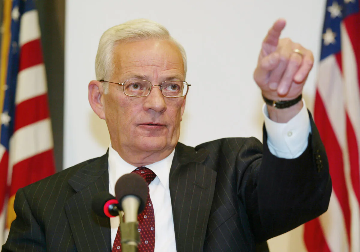 U.S. Secretary of the Treasury Paul O'Neill points to a reporter during a post G7 news conference at the World Bank Building in Washington on Sept. 28, 2002. (Hyungwon Kang/Reuters)