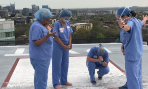 Nurses Gather at Hospital Helipad to Pray for Patients and Families Amid COVID-19 Outbreak
