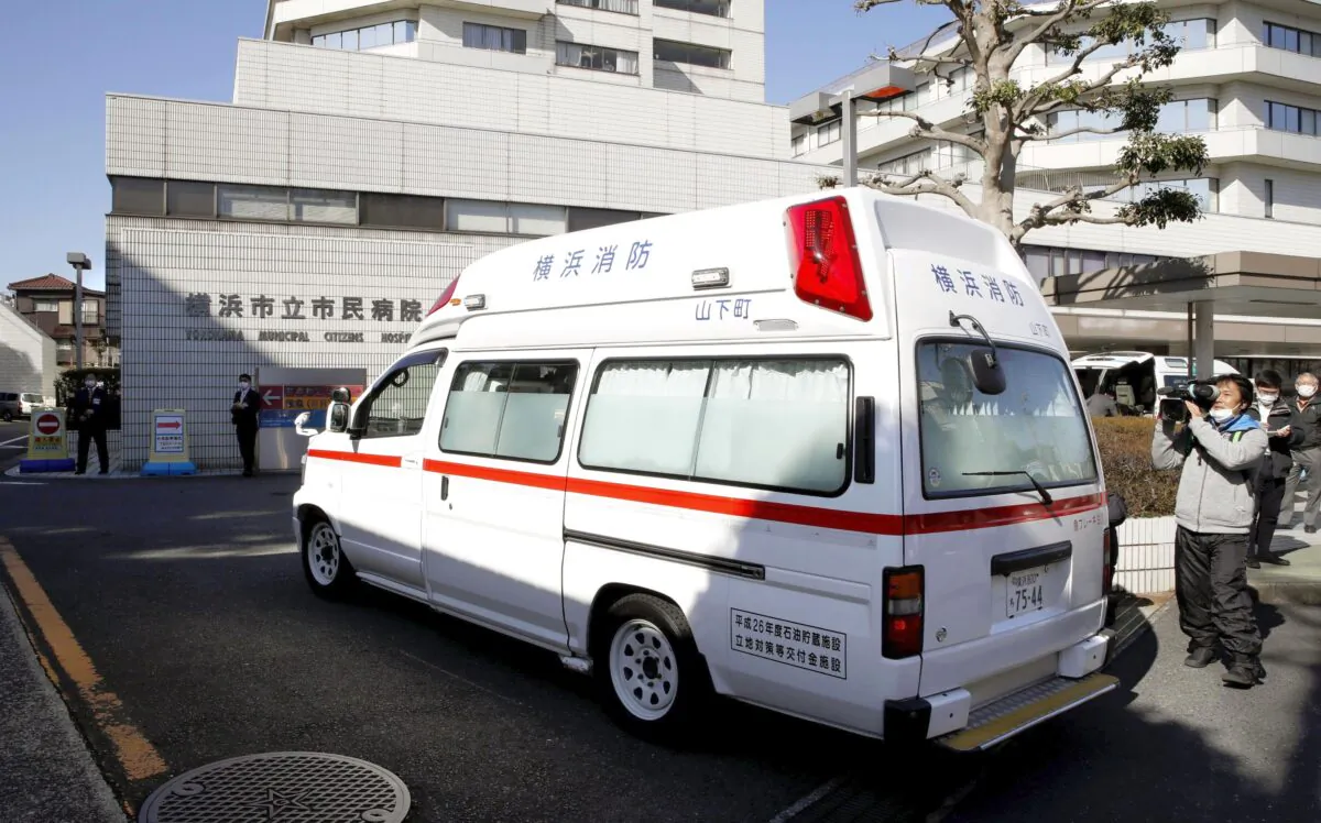 An ambulance carrying a passenger onboard cruise ship Diamond Princess arrives at a hospital in Yokohama, near Tokyo on Feb. 5, 2020. (Sadayuki Goto/Kyodo News via AP)