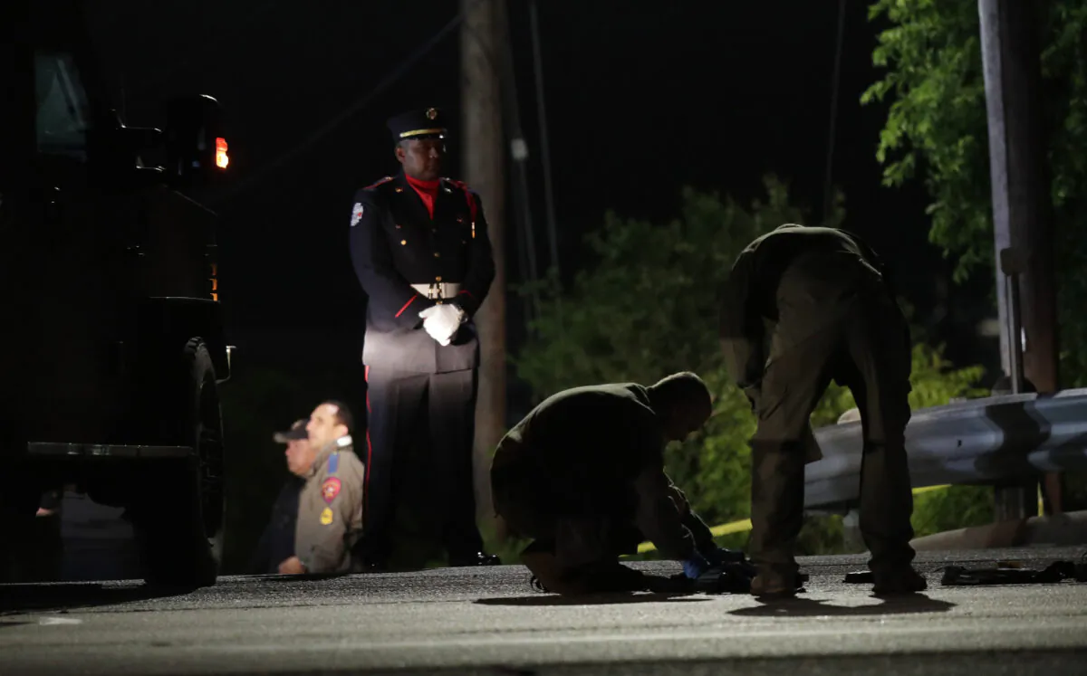 Police investigate the scene where, police say, a man shot and killed a San Marcos police officer and wounded two others in San Marcos, Texas, on April 18, 2020. (Eric Gay/AP Photo)