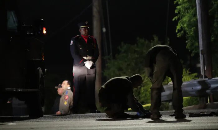 Police investigate the scene where, police say, a man shot and killed a San Marcos police officer and wounded two others in San Marcos, Texas, on April 18, 2020. (Eric Gay/AP Photo)