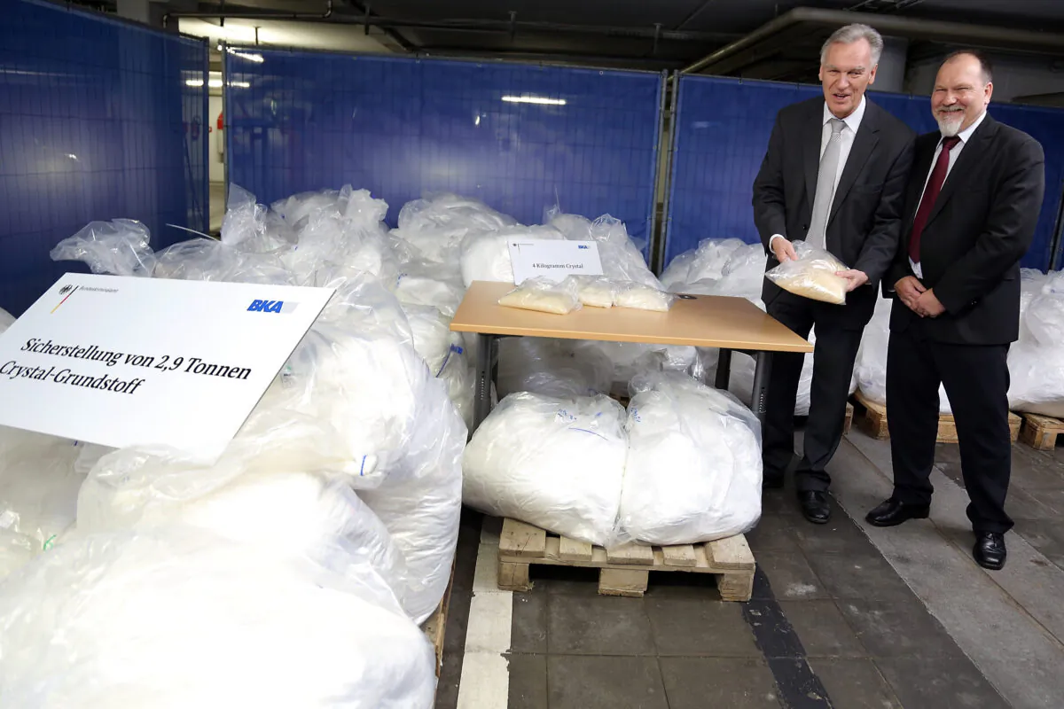 Joerg Ziercke, president BKA and Peter Ko, NPC, present portions of crystal met and 2.9 tonnes of confiscated chlorephedrin, one of the main ingredients used to manufacture methamphetamine.
WIESBADEN, GERMANY - NOVEMBER 13, 2014 (Hannelore Foerster/Getty Images)