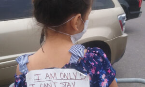 Mom Puts Sign on Daughter's Back in Grocery Store for Would-Be Social Distance Shamers