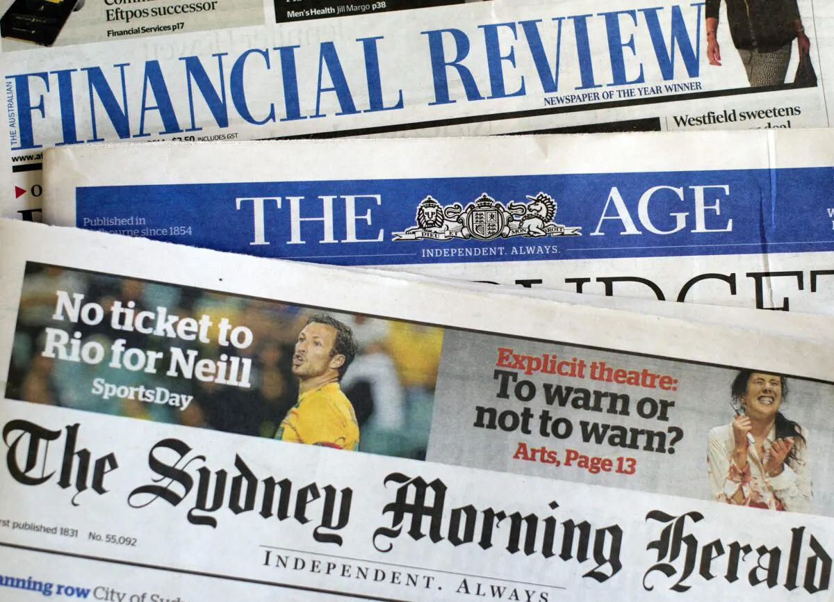 Newspaper front pages of media group Fairfax in Sydney on May 7, 2014. (SAEED KHAN/AFP via Getty Images)