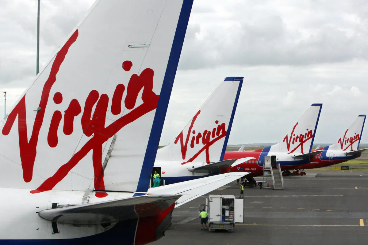 Virgin Blue line the apron at Sydney Airport on January 9, 2008. (Torsten Blackwood/Getty Images)