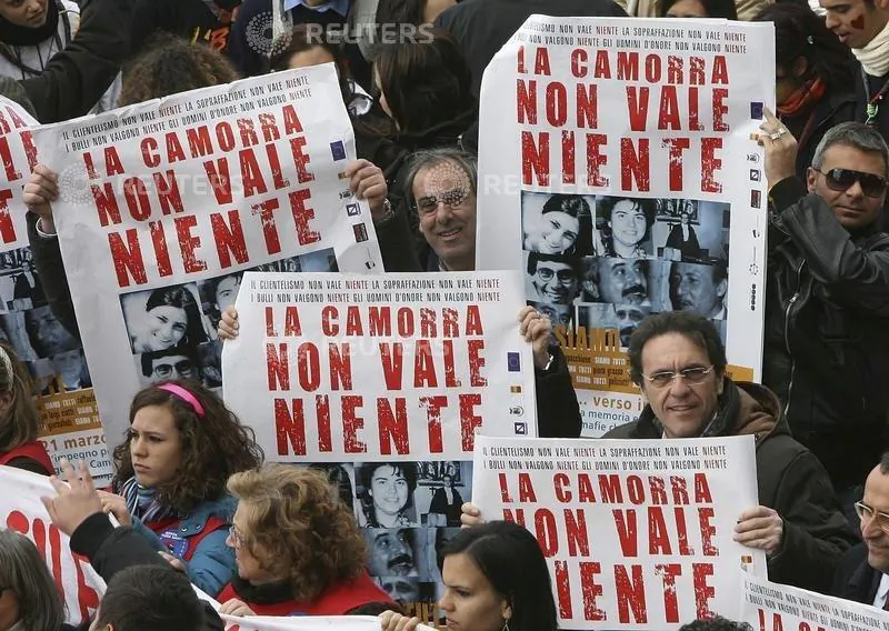 Demonstrators hold banners reading "Camorra worth nothing" as they march in the southern city of Naples March 21, 2009. (Ciro De Luca/Reuters File)