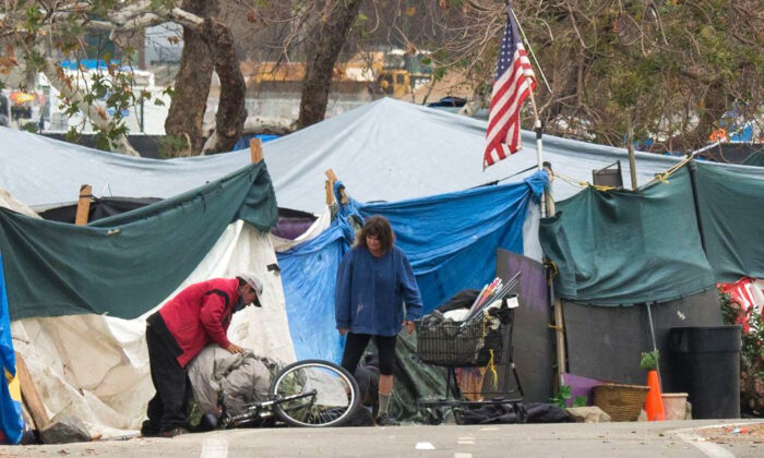 A homeless encampment made of tents and tarps lines the Santa Ana riverbed near Angel Stadium in Anaheim, Calif., on Jan. 25, 2018. (Robyn Beck/AFP via Getty Images)