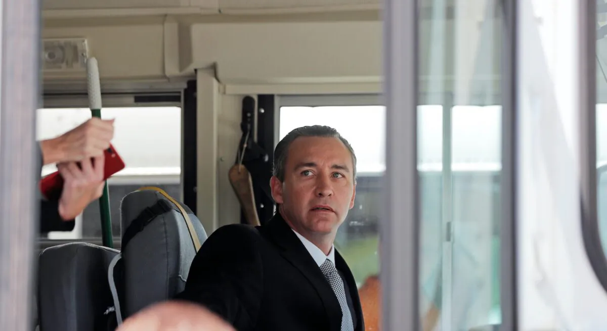Tony Spell, pastor of the Life Tabernacle Church, sits in the drivers seat of one of his church buses as he prepares to leave the East Baton Rouge Parish jail after posting bond in Baton Rouge, La., on April 21, 2020. (Gerald Herbert/AP photo)