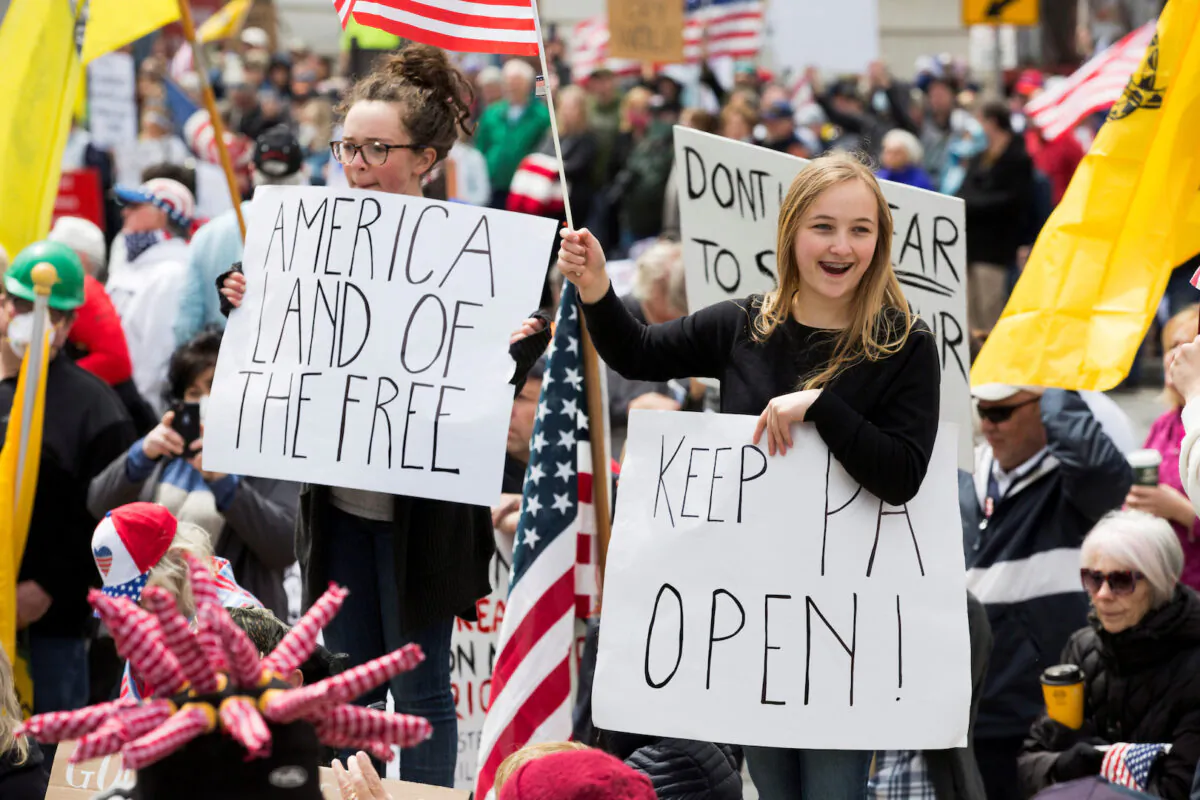 Demonstrators gather to protest against the state's extended stay-at-home order to help slow the spread of the CCP virus in Harrisburg, Pennsylvania, on April 20, 2020. (Rachel Wisniewski/Reuters)